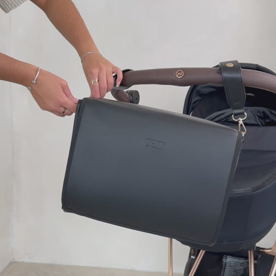 zen3 changing bag closed being attached to a stroller pram