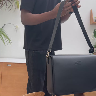 zen3 baby bag with built in changing bed being worn as a messenger